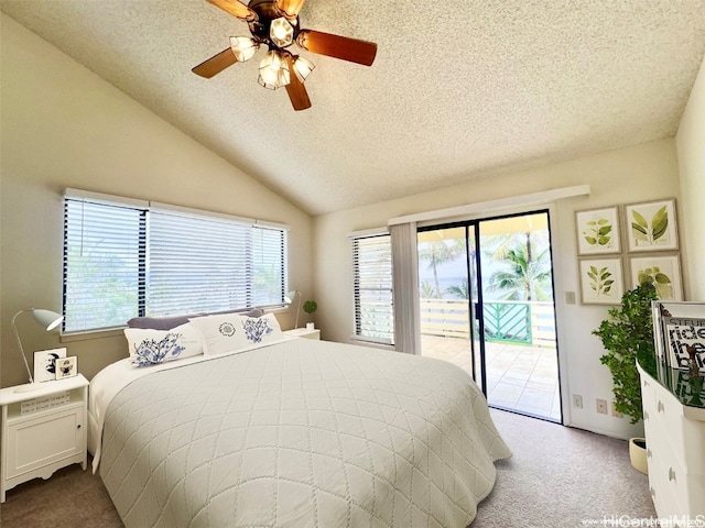 carpeted bedroom with ceiling fan, lofted ceiling, a textured ceiling, and access to outside