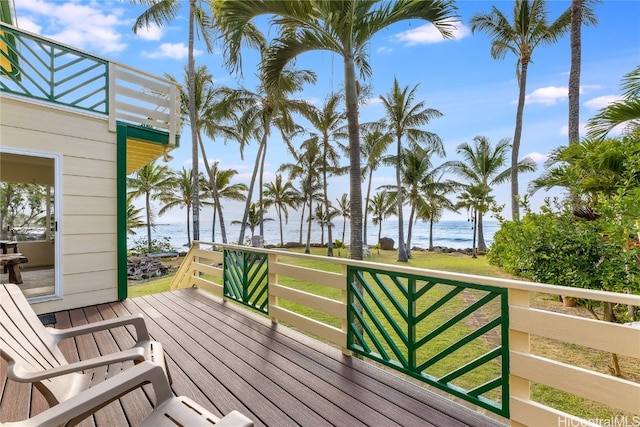 wooden terrace featuring a water view