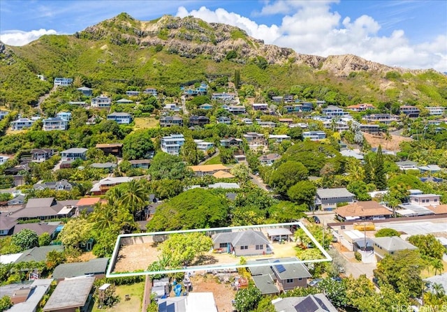 drone / aerial view featuring a residential view and a mountain view