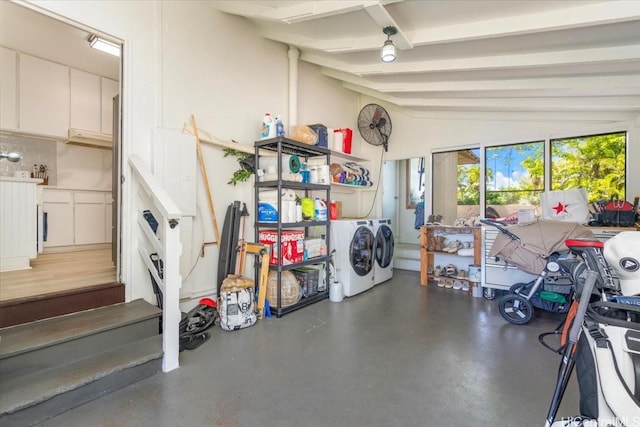 garage featuring washing machine and dryer