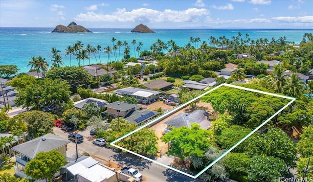 drone / aerial view with a water view and a residential view