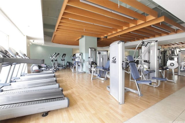 exercise room with wood finished floors