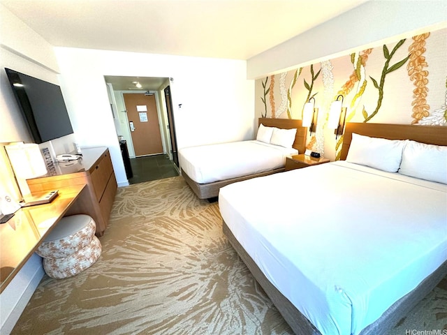 carpeted bedroom featuring baseboards