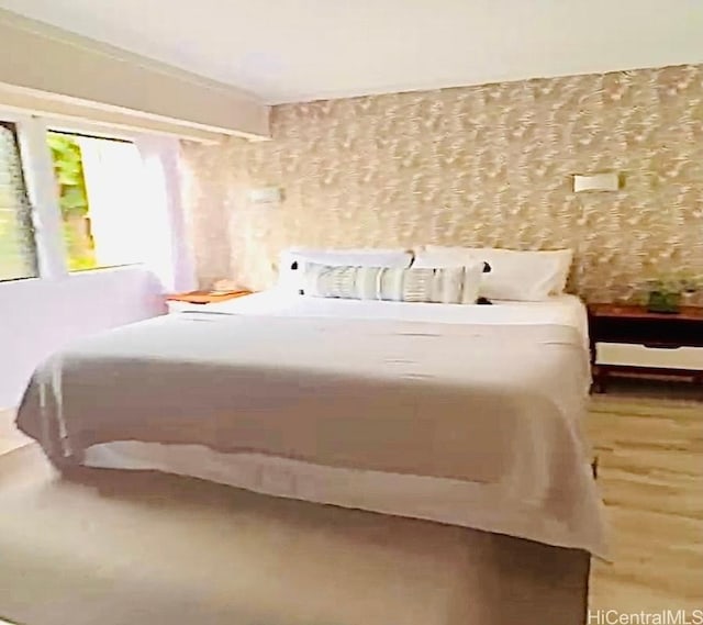 bedroom featuring wood finished floors