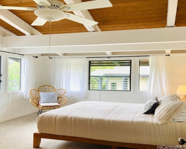 bedroom with carpet flooring, ceiling fan, beamed ceiling, and wood ceiling