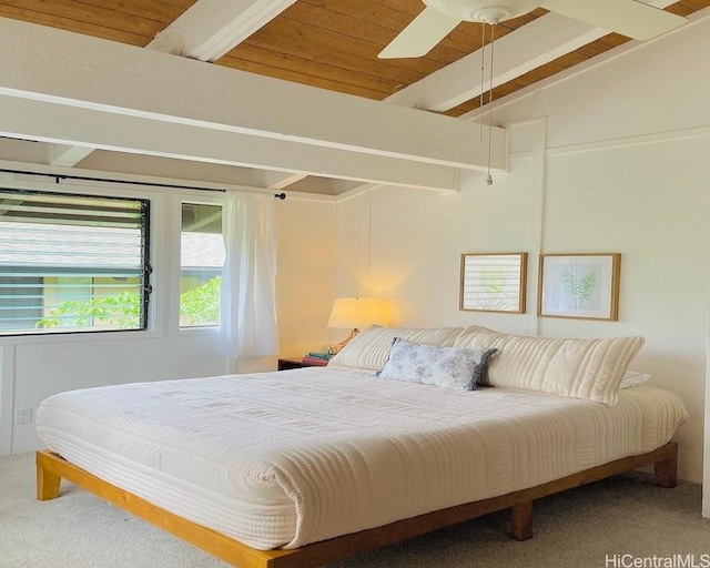 bedroom featuring lofted ceiling with beams, a ceiling fan, carpet, and wood ceiling