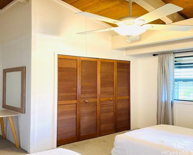 unfurnished bedroom with carpet, a closet, and ceiling fan