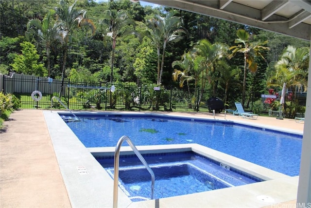 view of pool featuring a community hot tub