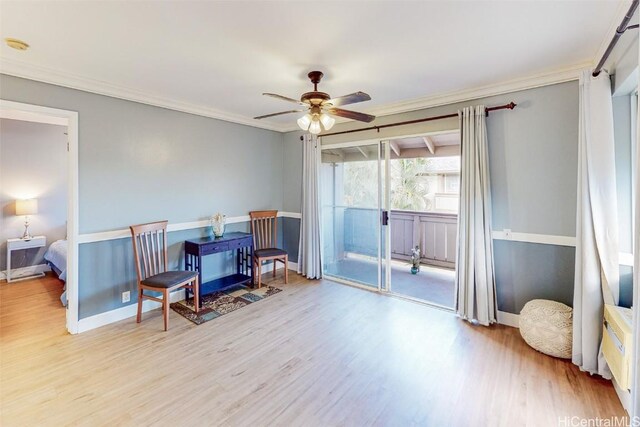 sitting room featuring light hardwood / wood-style floors, ornamental molding, and ceiling fan