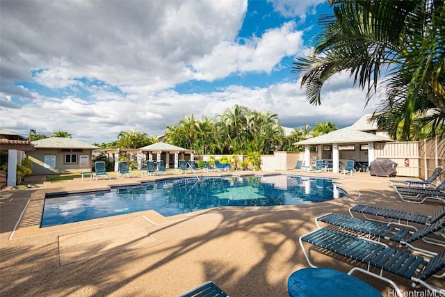 view of pool featuring grilling area and a patio area