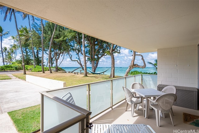 balcony featuring a water view