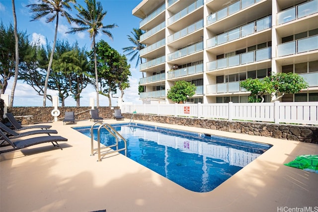 view of swimming pool featuring a patio