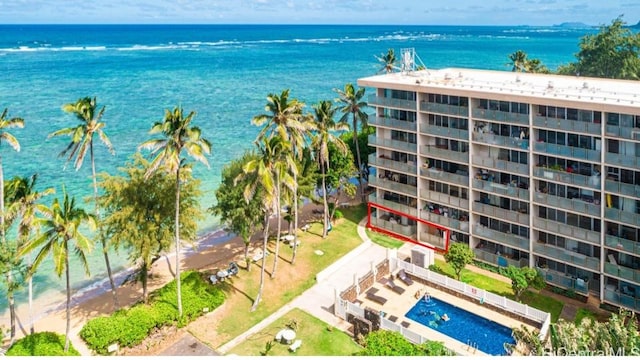 bird's eye view featuring a water view and a beach view