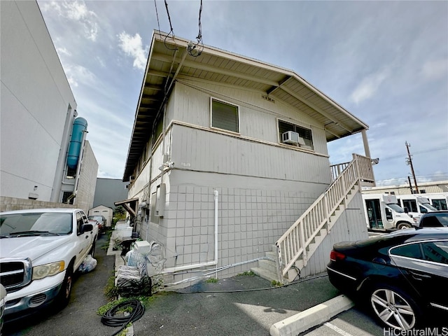 view of side of home featuring cooling unit