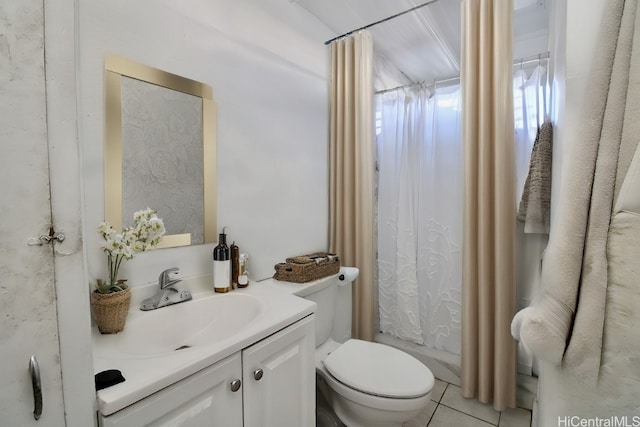 bathroom with vanity, toilet, curtained shower, and tile patterned flooring