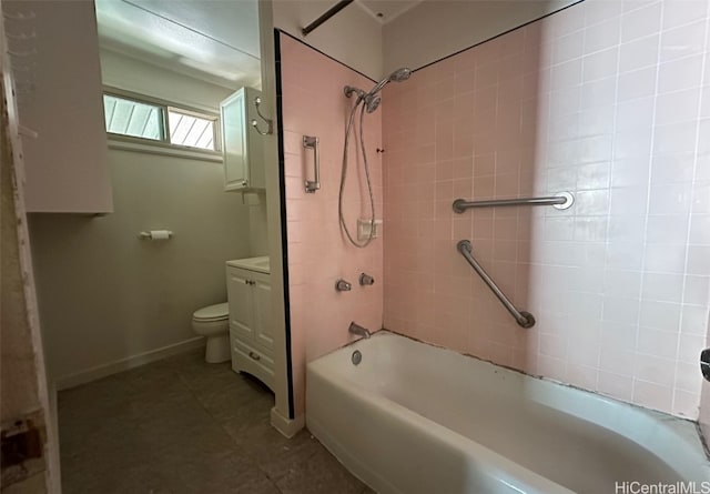 full bathroom with toilet, tiled shower / bath, and vanity