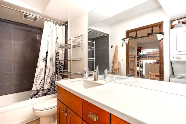 full bathroom featuring vanity, stacked washer / drying machine, toilet, and shower / bathtub combination with curtain