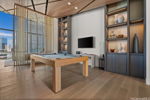 playroom with pool table, hardwood / wood-style flooring, built in features, and wood ceiling