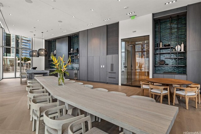 1000 Auahi St Unit 2506, Honolulu, HI 96814 - dining space featuring floor to ceiling windows, recessed lighting, and wood finished floors