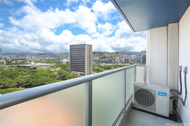 balcony with ac unit and a mountain view