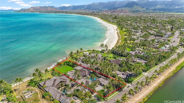 drone / aerial view with a water and mountain view