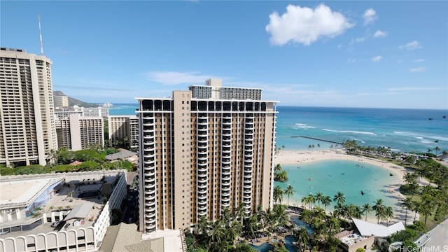 exterior space with a water view and a beach view