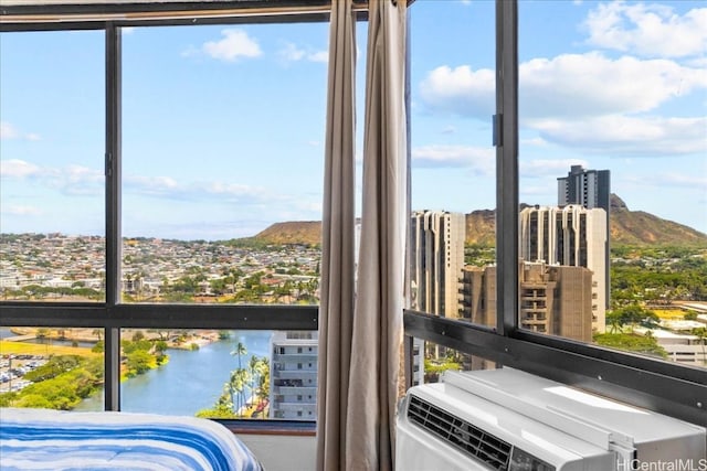 interior space with a water and mountain view