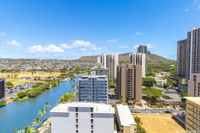 drone / aerial view with a water and mountain view