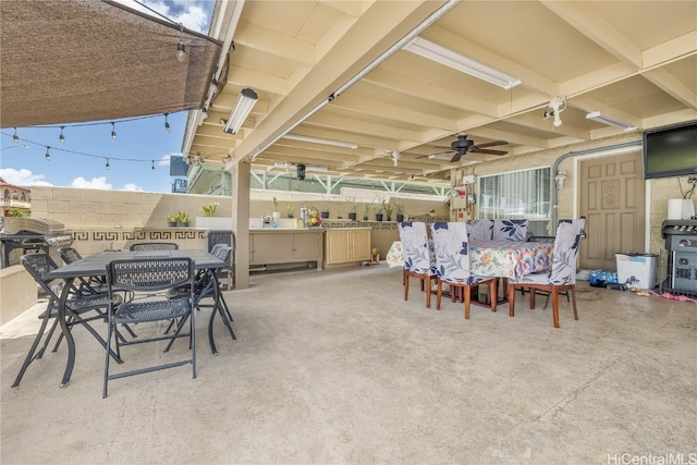 view of patio featuring ceiling fan and grilling area