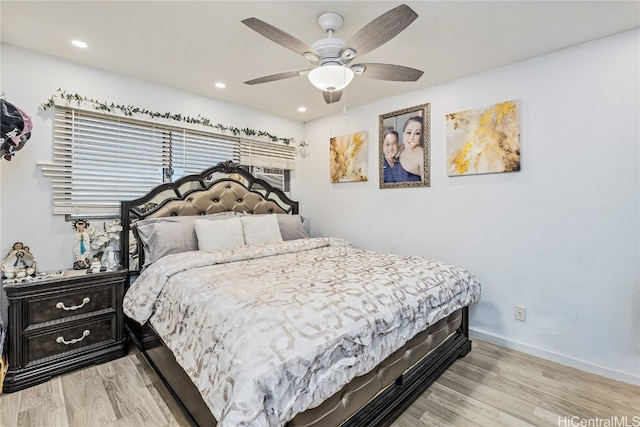 bedroom featuring ceiling fan and light hardwood / wood-style flooring