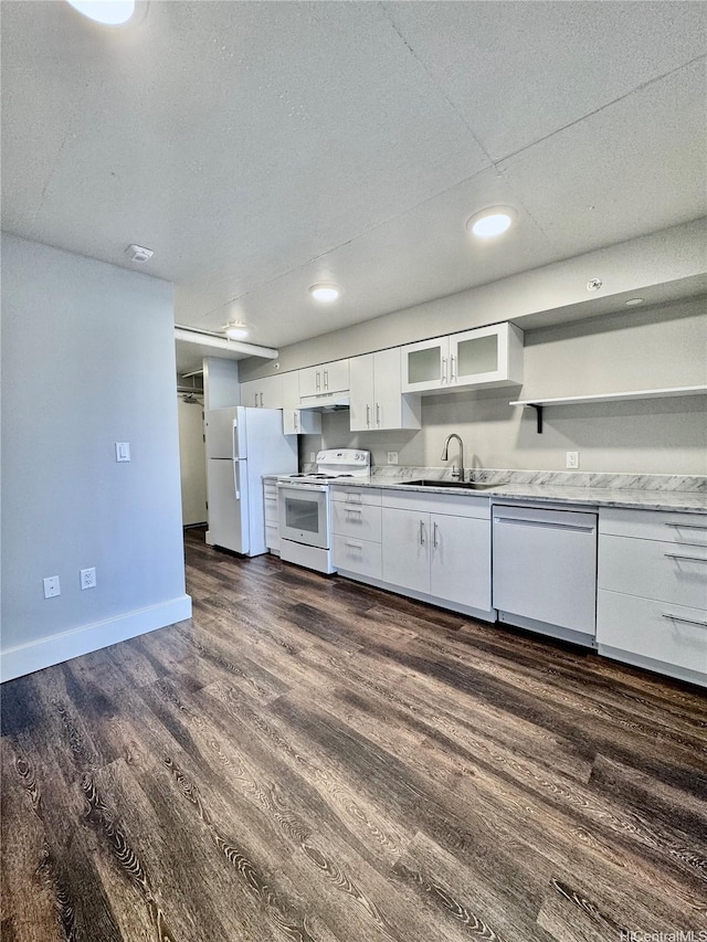 803 Waimanu St Unit 426, Honolulu, HI 96813 - kitchen with white appliances, white cabinetry, dark wood-style flooring, glass insert cabinets, and recessed lighting