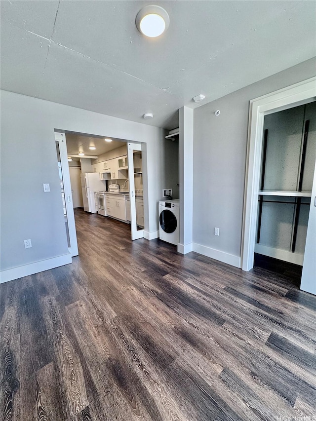 803 Waimanu St Unit 426, Honolulu, HI 96813 - unfurnished living room featuring washer / dryer and dark wood-style floors