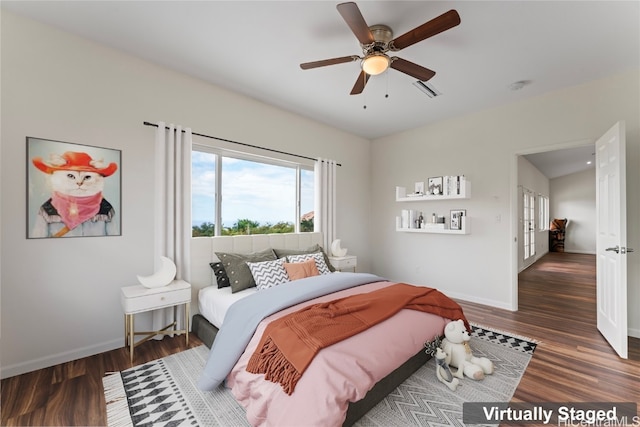 bedroom featuring ceiling fan and dark hardwood / wood-style floors