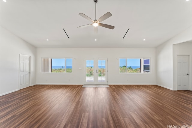 unfurnished living room featuring ceiling fan, lofted ceiling, dark hardwood / wood-style flooring, and french doors