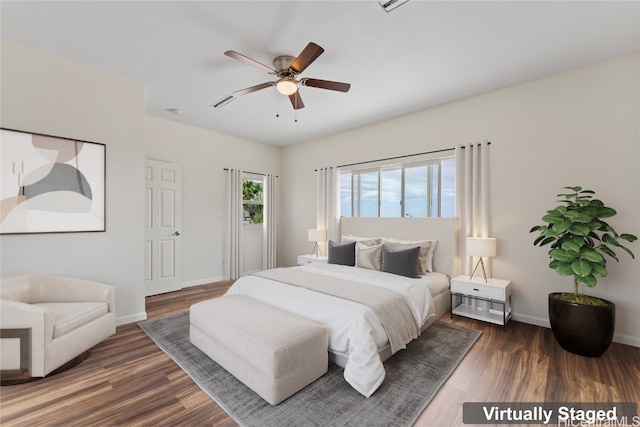 bedroom featuring dark hardwood / wood-style floors and ceiling fan