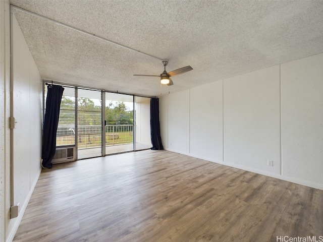 empty room with hardwood / wood-style floors, a textured ceiling, and ceiling fan