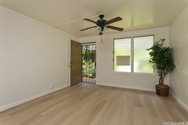 spare room with ceiling fan and light hardwood / wood-style floors