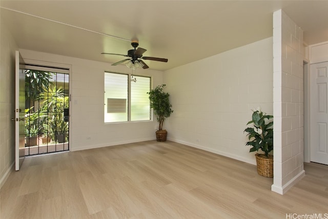 empty room featuring ceiling fan and light wood-type flooring