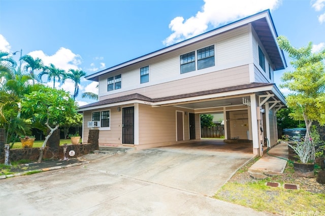 view of front of home featuring cooling unit and a carport