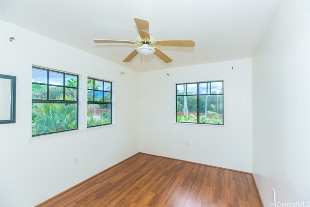 spare room with wood-type flooring and ceiling fan