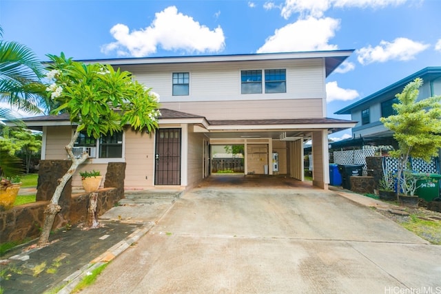 view of front of property featuring a carport