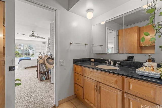 bathroom featuring tile patterned flooring, vanity, and ceiling fan