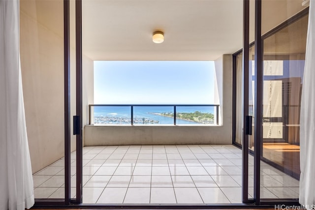 balcony featuring a water view