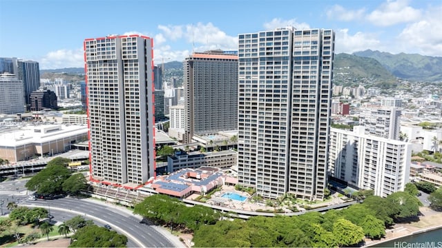 property's view of city featuring a mountain view