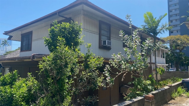 view of side of home with cooling unit