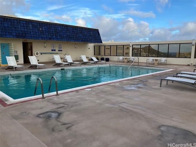 view of pool featuring a patio