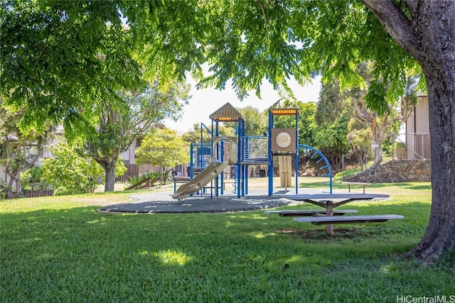 view of jungle gym featuring a lawn