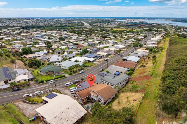 drone / aerial view featuring a water view and a residential view