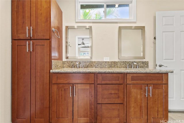 bathroom with a sink and double vanity