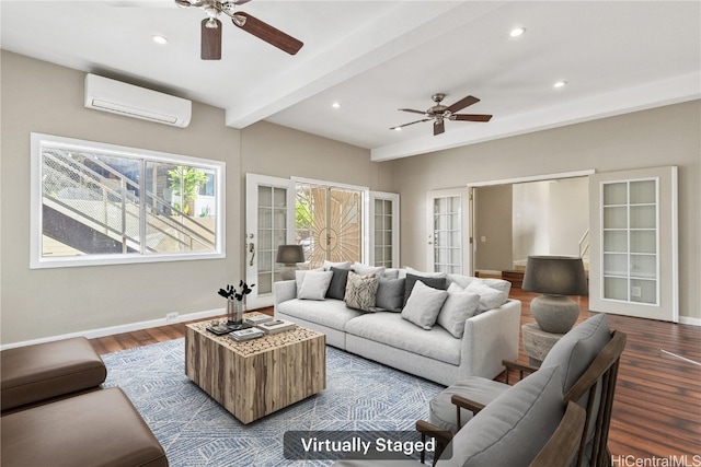 living area featuring dark wood finished floors, beamed ceiling, an AC wall unit, and baseboards